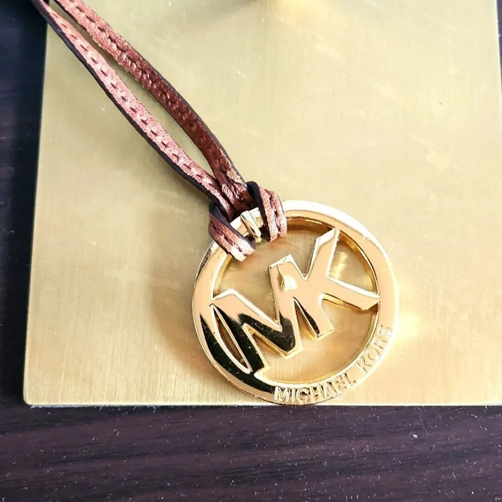 Michael Kors Gold Logo Pendant with Brown Cord